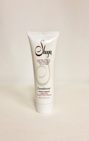 A tube of conditioner sitting on top of a table.