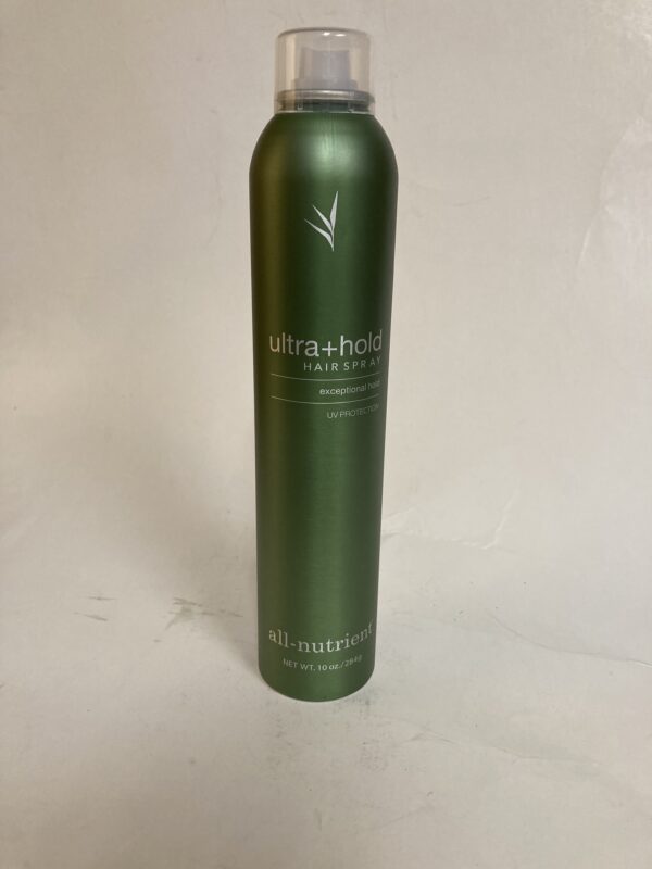 A green bottle of hair spray on top of a white table.