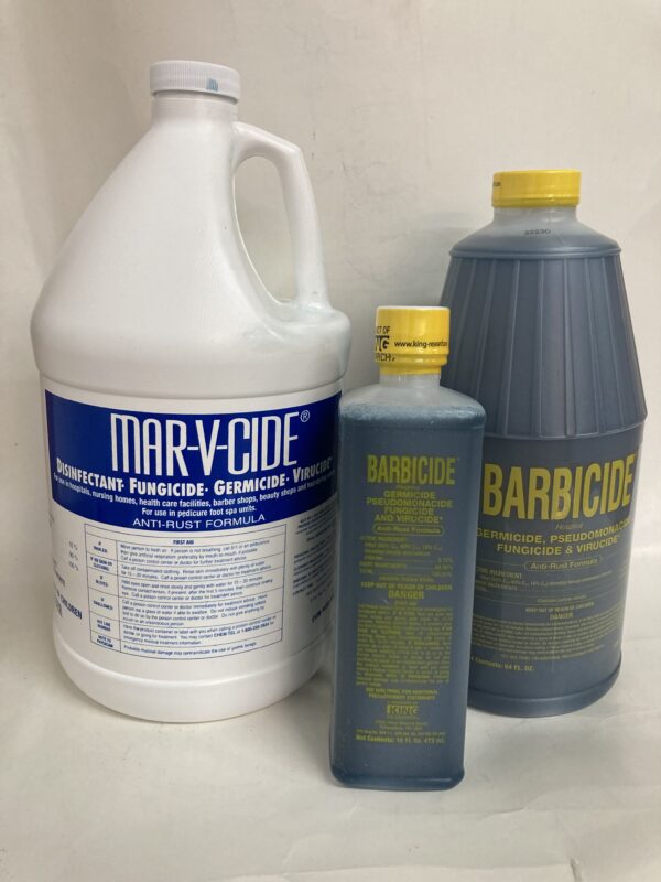 A bottle of barbicide and two containers of disinfectant.