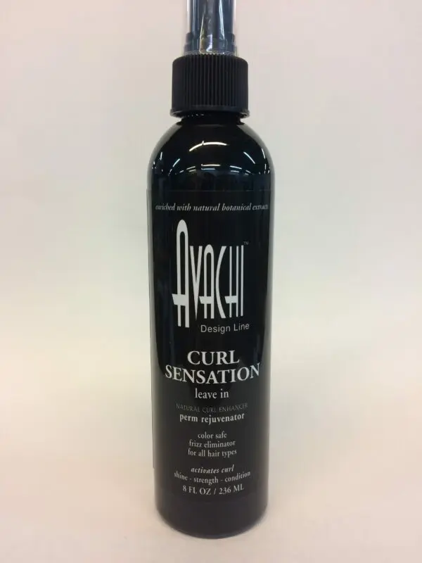 A bottle of hair spray that is black and white.