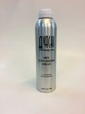 A silver spray can of hair texturizing product.