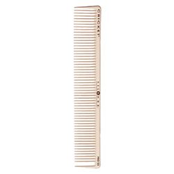 A white comb is standing up against the wall.