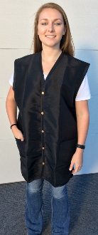 A person wearing a black vest with gold buttons.