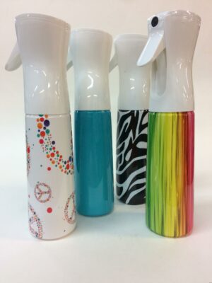 A group of spray bottles with different designs on them.
