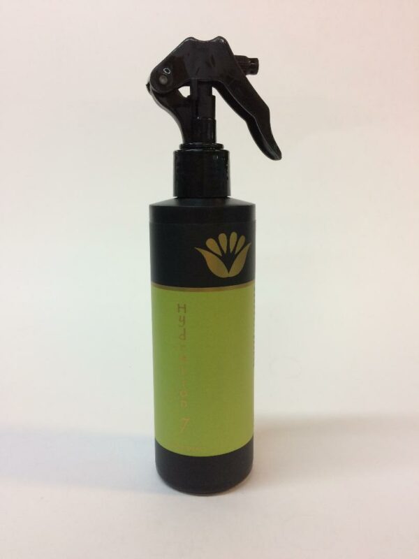 A spray bottle with a black and green lid.