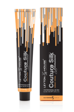 A tube of orange and black hair dye next to the box.