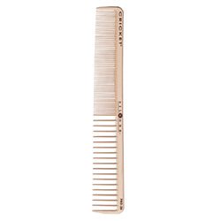 A comb is standing up against the wall.