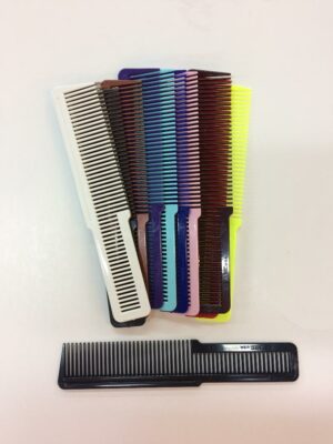 A bunch of different colored combs are on the table