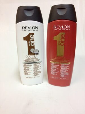 Two bottles of hair products are sitting on a table.