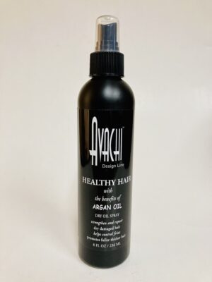 A bottle of hair spray sitting on top of a table.