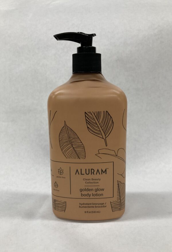 A bottle of body lotion with leaves on it.