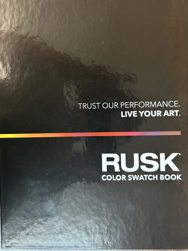 A black book with the words trust our performance. Live your art.